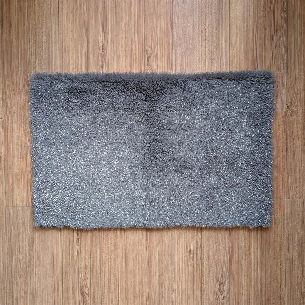 Gray rug on a wooden floor