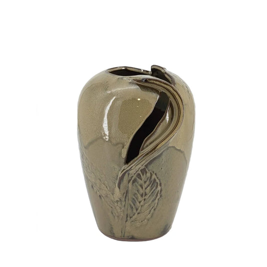 Beige ceramic vase with leaf design on a white background