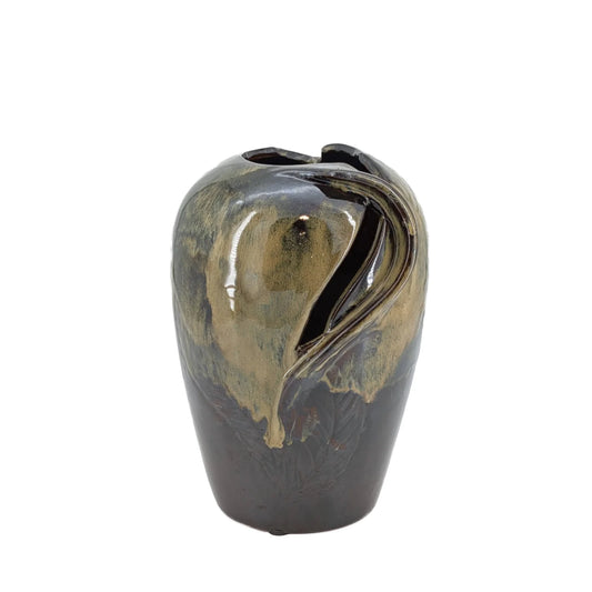 Decorative vase with gold and black design on a white background