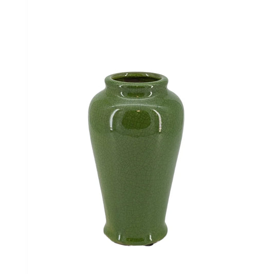 Green ceramic vase on a white background