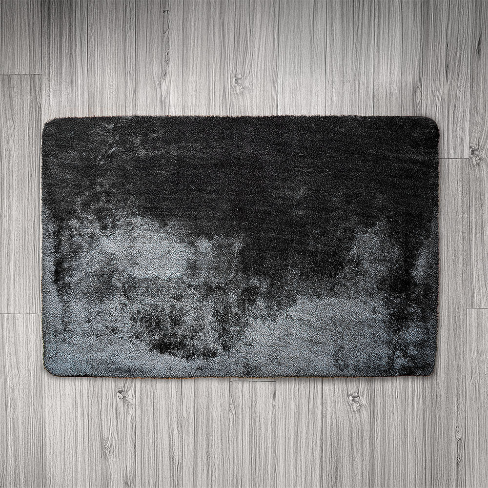 Gray textured rug on a wooden floor
