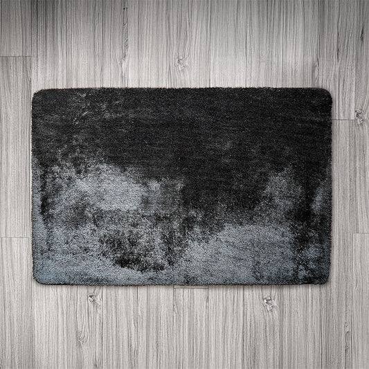 Gray textured rug on a wooden floor
