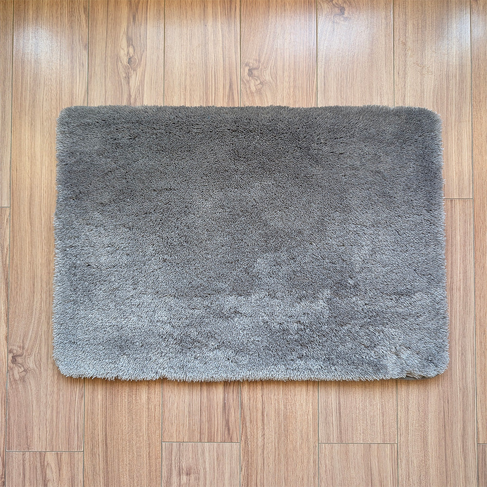 Gray rug on a wooden floor