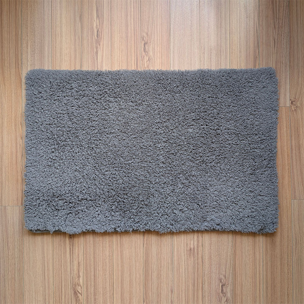 Gray rug on a wooden floor