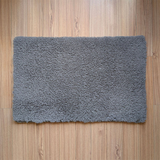 Gray rug on a wooden floor