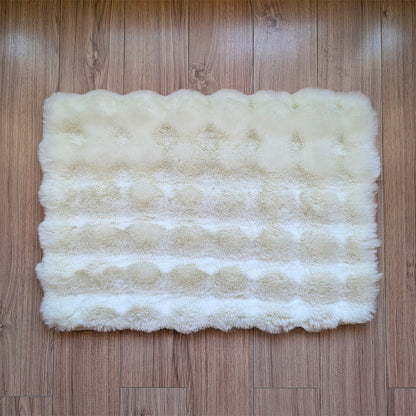 White fluffy rug on a wooden floor