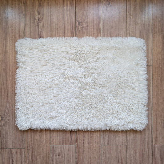 White fluffy rug on a wooden floor