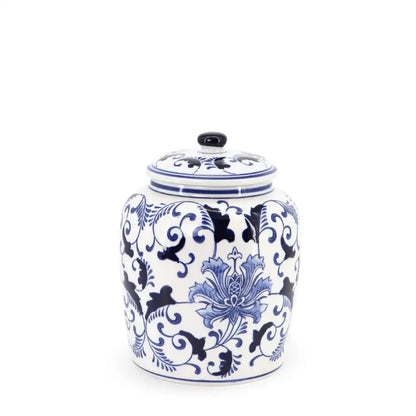 Ceramic jar with blue floral and scroll patterns on a white background
