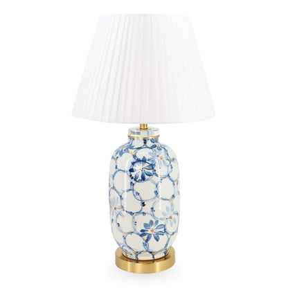 Decorative table lamp with floral design on a white background