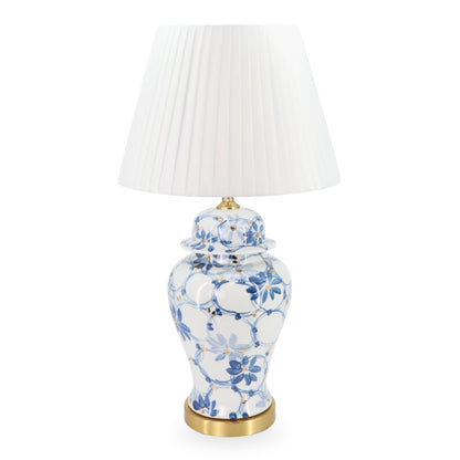 Decorative table lamp with floral design on a white background