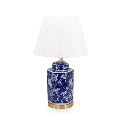 Ceramic table lamp with blue floral design on a white background