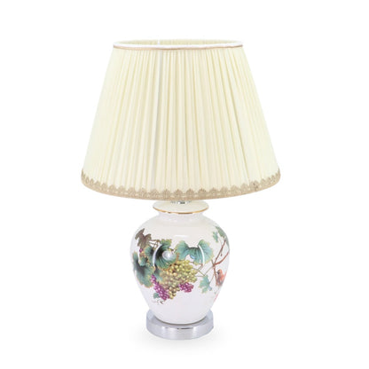 Decorative table lamp with floral design on a white background